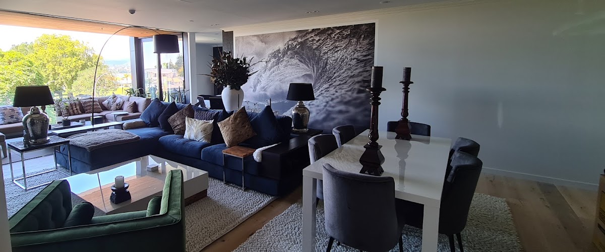 A living room with a large black-and-white mural feature wall painted by Regency Painters