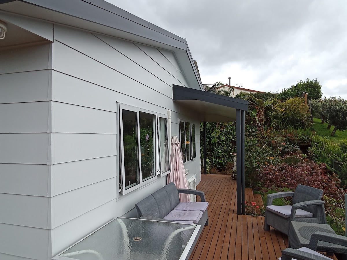 Painted exterior with a covered deck area