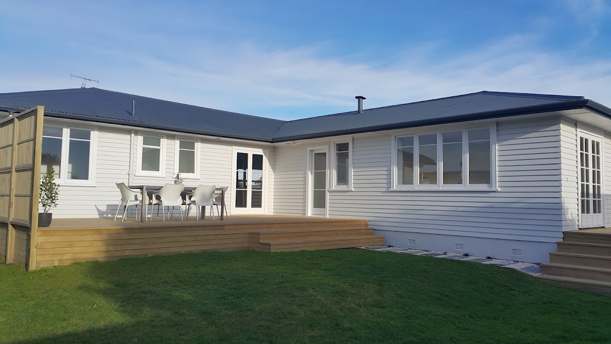 A single-storey weatherboard home with a fresh exterior repaint and new deck